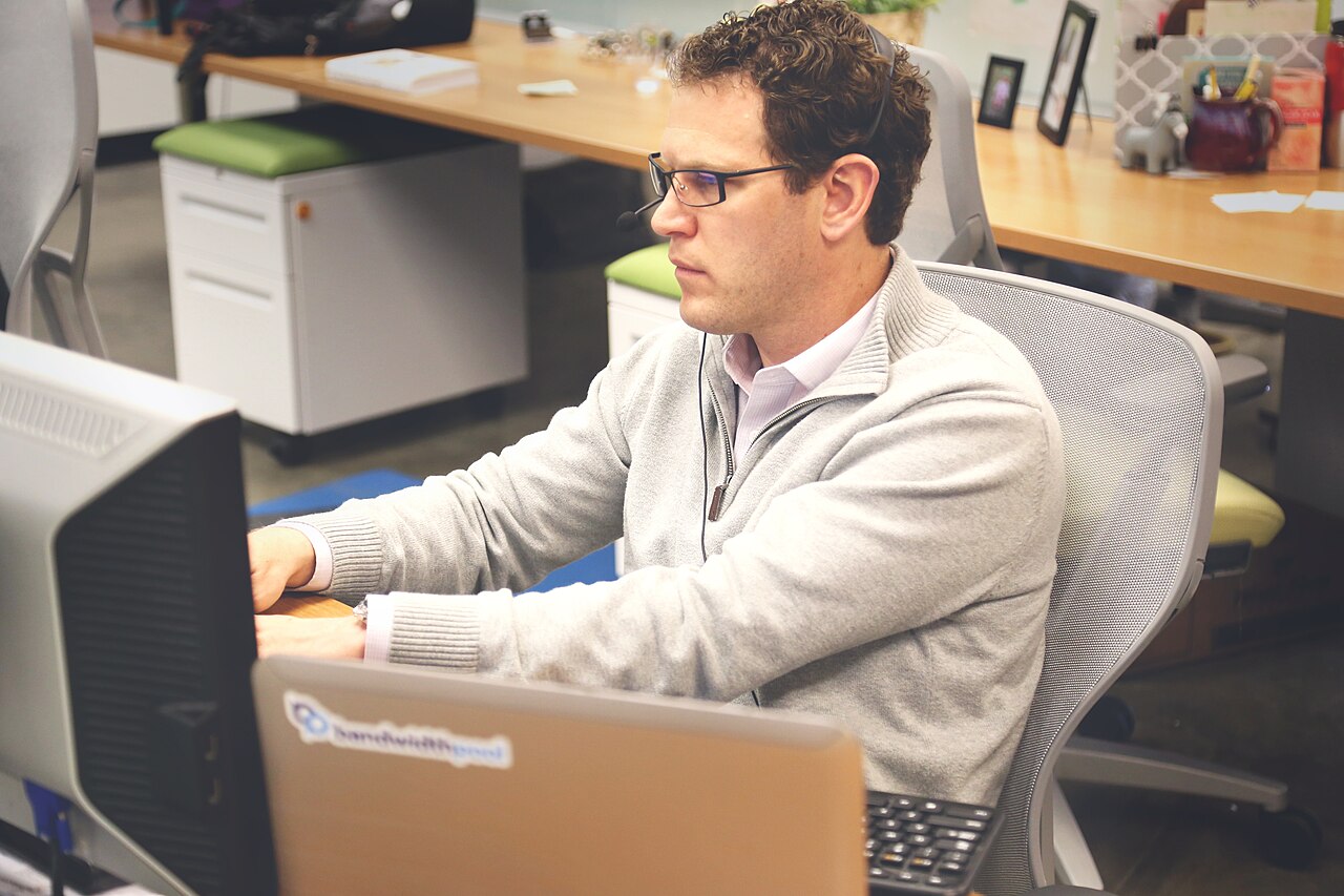 Open coworking space where teams collaborate on open innovation