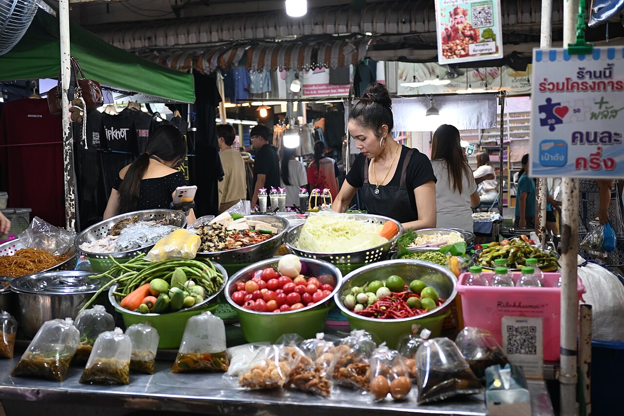 Food stall vendor at a night market, a common type of household business in Vietnam